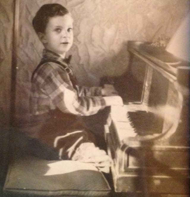 John Simon at the piano, age 4